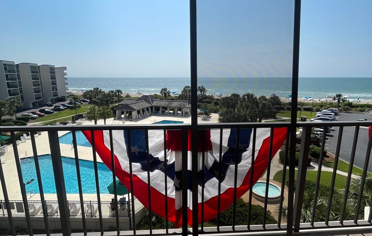 Oceanfront condo with screened in enclosure.