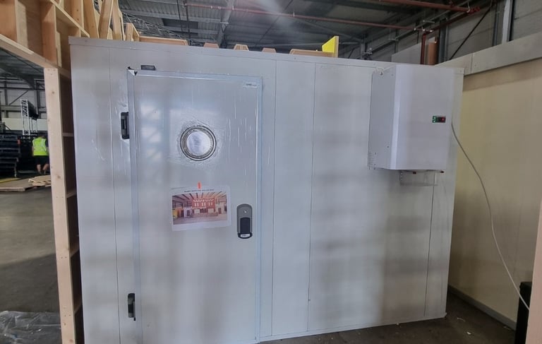 A freezer room with straddle unit