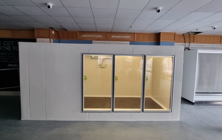 a large glass cold room with spilit cooling unit