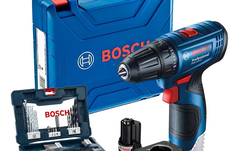 a man in a blue shirt and glasses is using a drillet