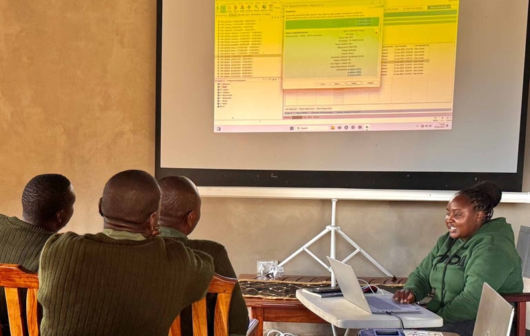 Researchers in classroom looking at presentation