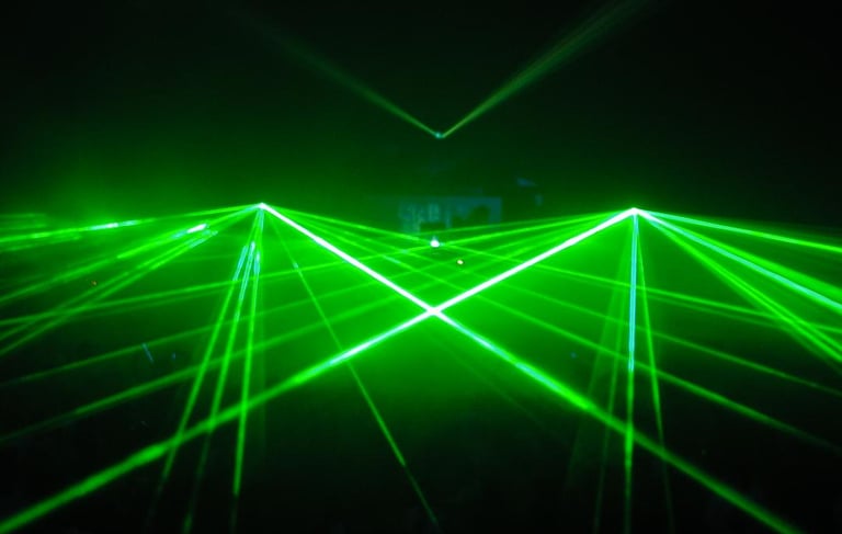 Green lasers at a large rave show laser laser laser laser laser laser