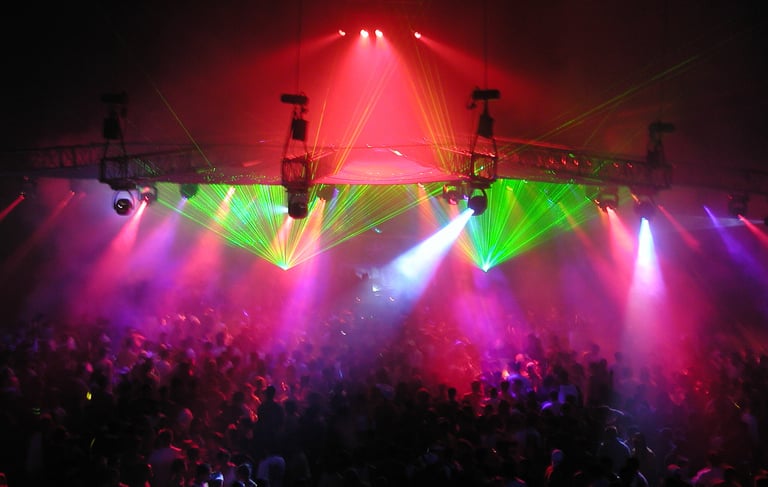 a large group of people standing around a stage
