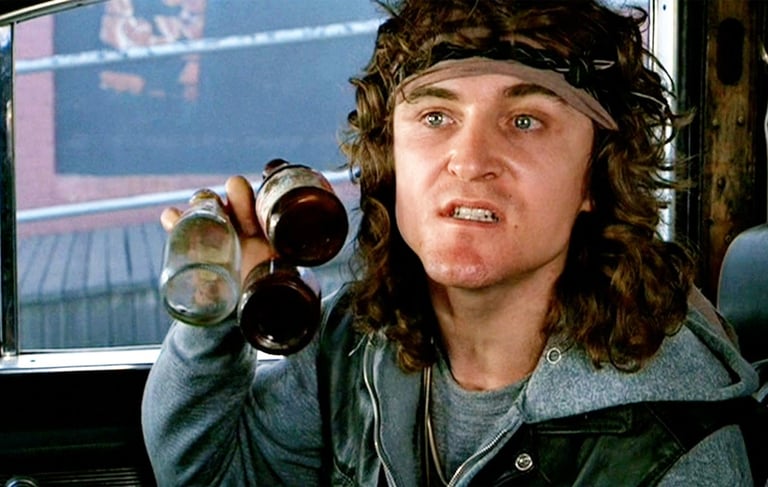 a man with a hat and a beer glass