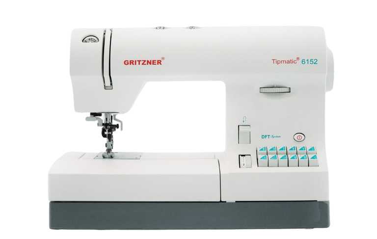 a sewing machine with a white sewing machine