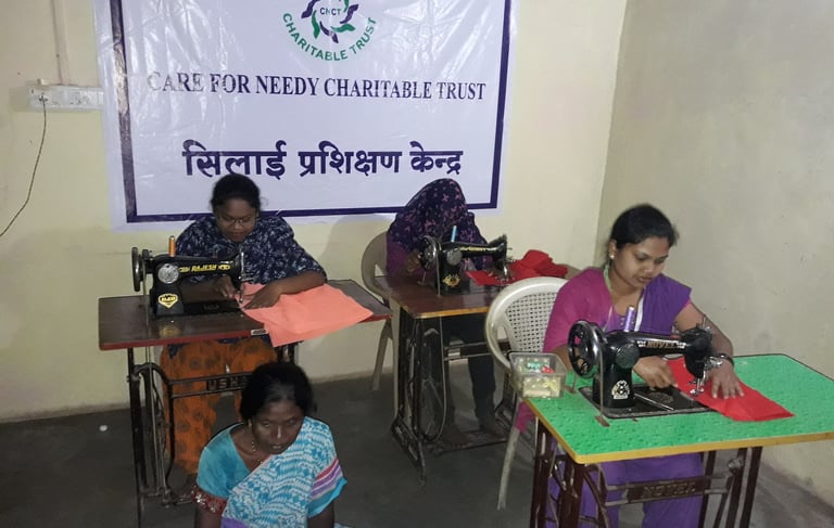 a group of women sitting at desks in a room stitching
