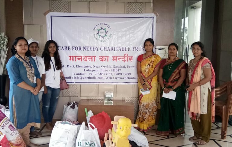 a group of women standing around with bags of food