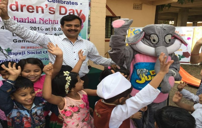 a man and a children and a stuffed animal dancing