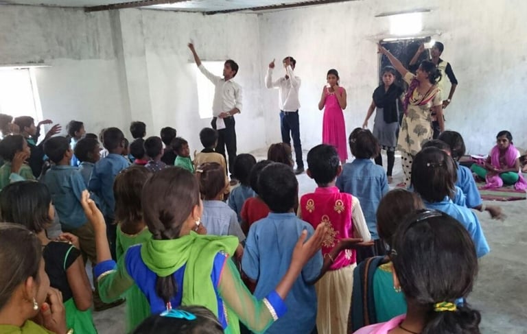 a group of people standing around a room