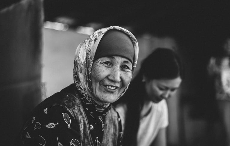 a woman with a headscarf smiling