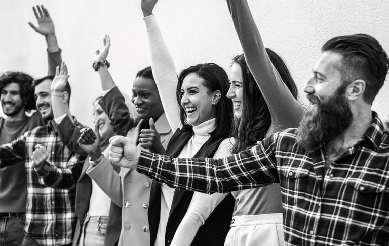 a group of people standing in a line with their hands up
