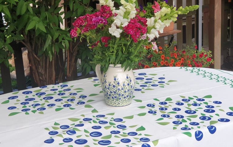 a vase with flowers in a vase on a table