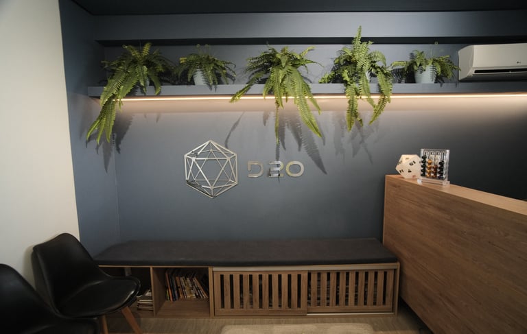a desk with a desk and chairs in a room
