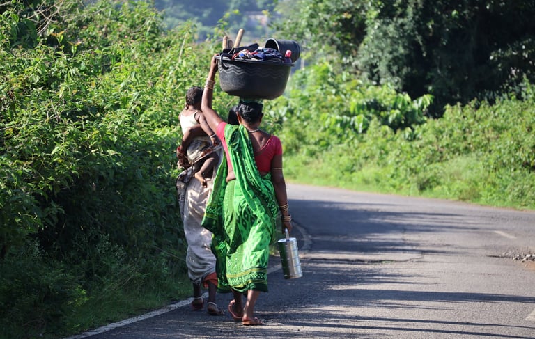 odia women with child going to work on their fields in the morning