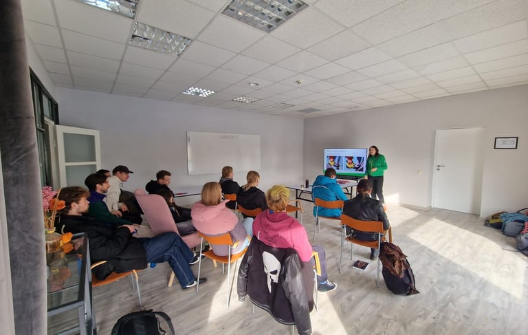 a group of people sitting in chairs in a room