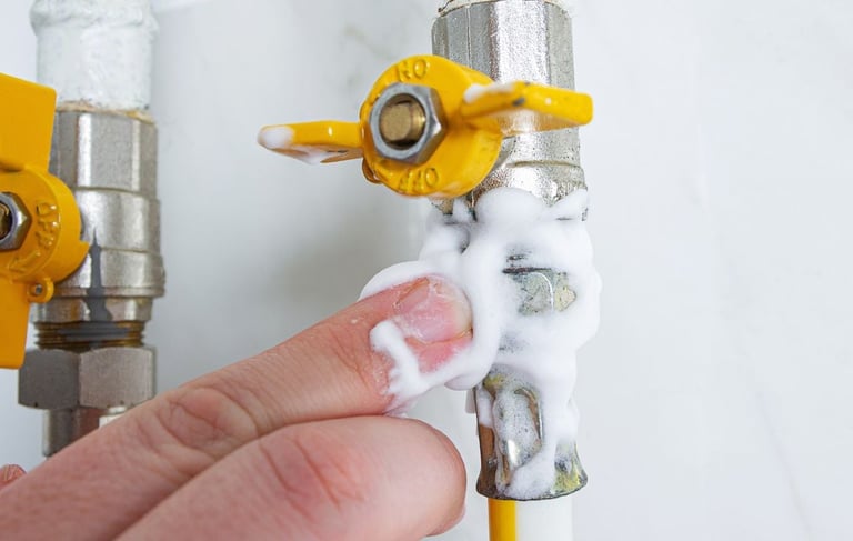 a person holding a pipe of soap and a pipe of soap
