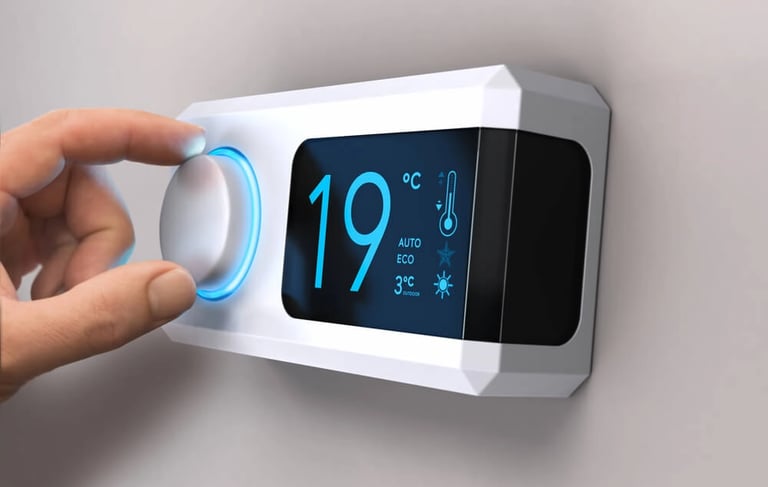 a person turning off thermostar on a wall