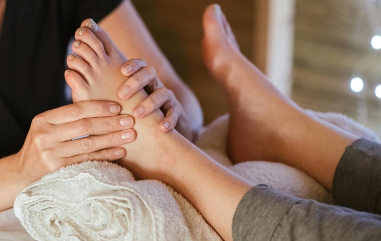 a woman is shown with her hands on her feet