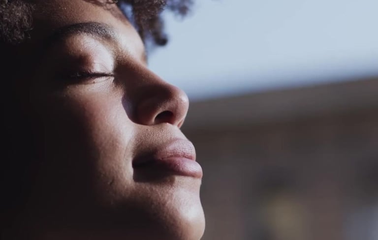 a woman with her eyes closed and her eyes closed