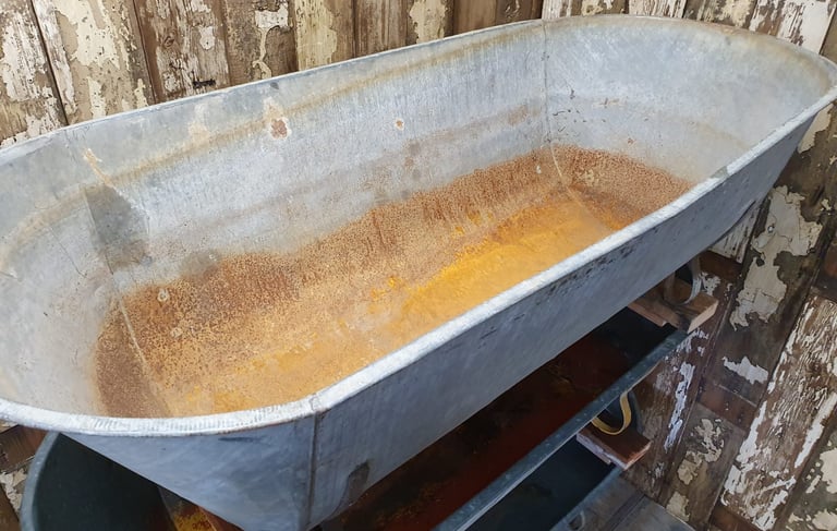 a bathtub with rusted metal tub