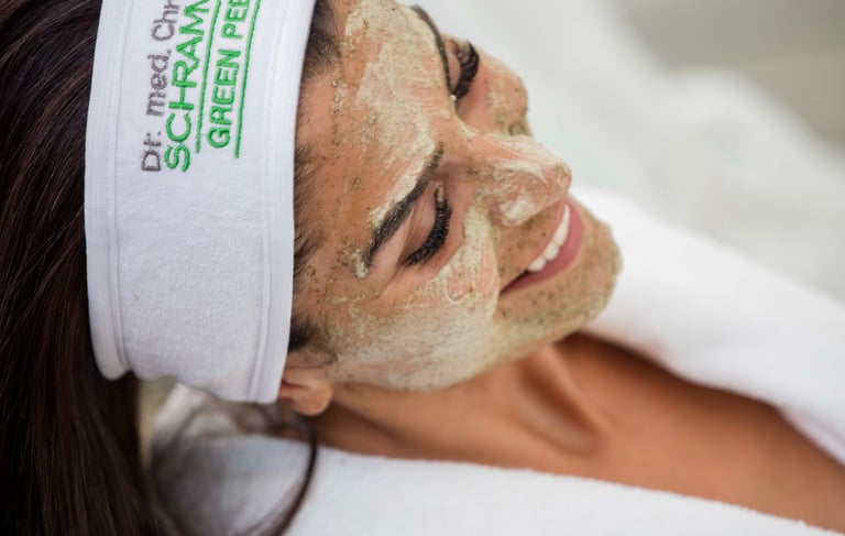 a woman with a towel wrapped around her face of dr schrammek