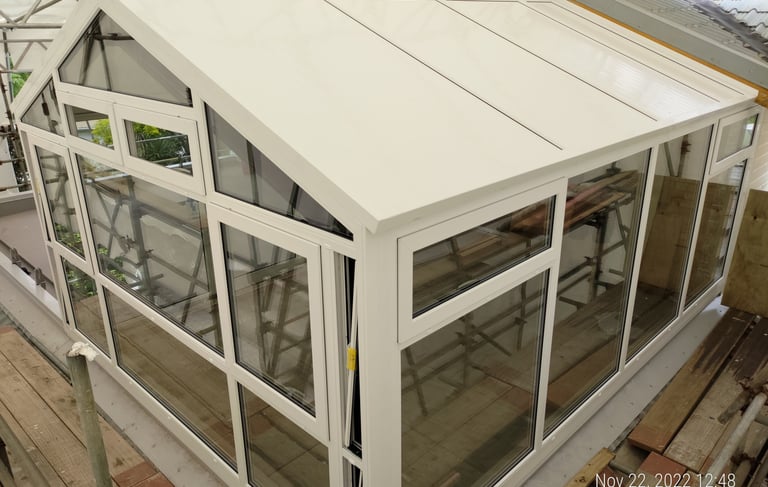 Modern UPVC conservatory with glass roof extending Auckland home living space, New Zealand