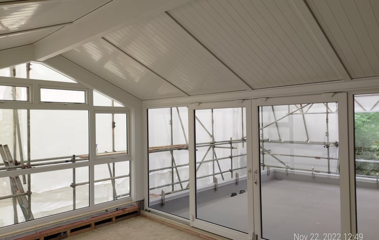 Modern UPVC conservatory with glass roof extending Auckland home living space, New Zealand