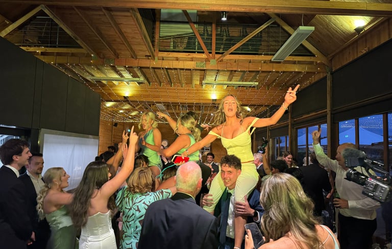 Full wedding dancefloor with DJ TUX providing professional event entertainment.