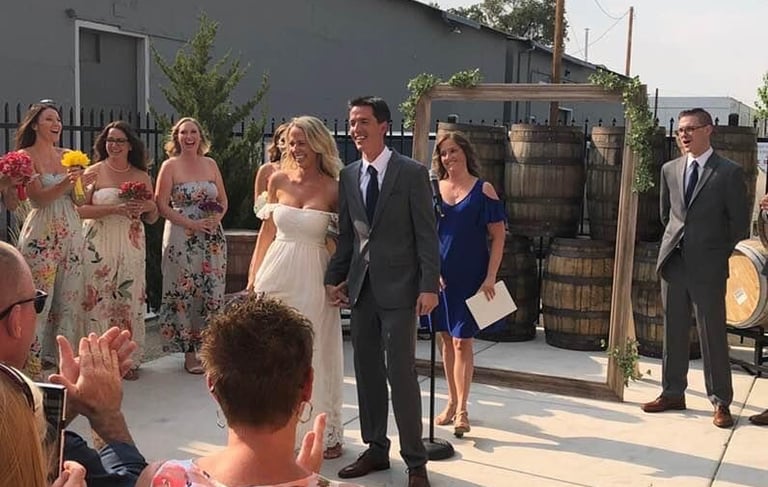 Wedding officiant with happy couple