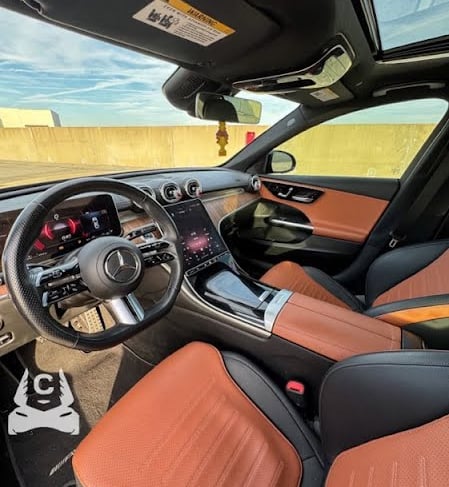 Mercedes C300 interior dashboard with leather seats and dual screen display