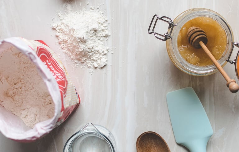 a table with a cake ingredients