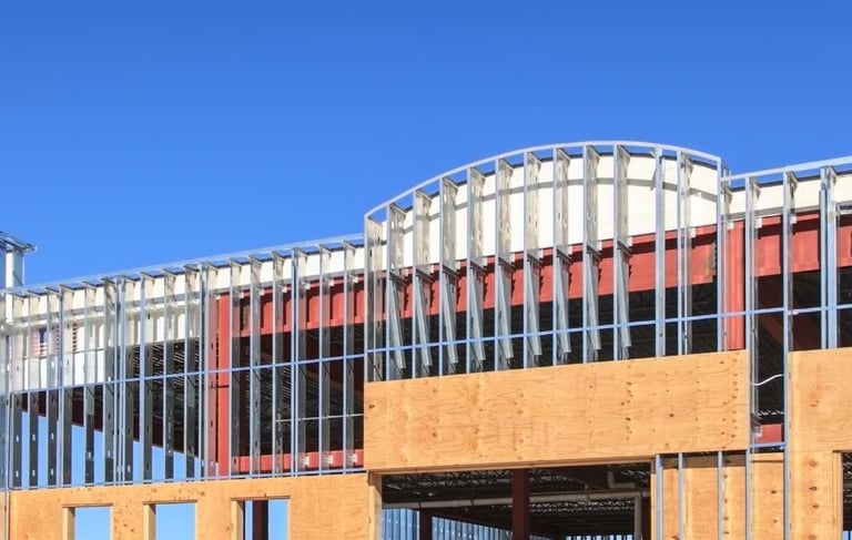 a building with a clock tower in the foreground