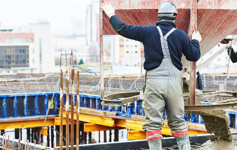 a man in a construction site with a crane
