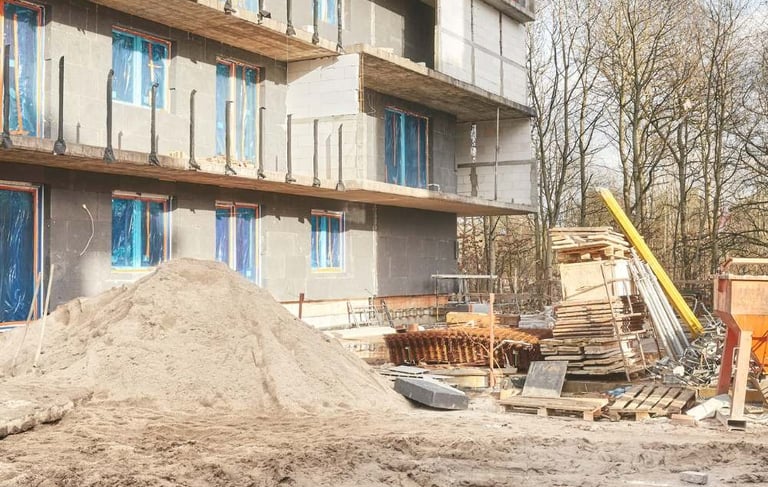 a pile of rubble and rubble in front of a building