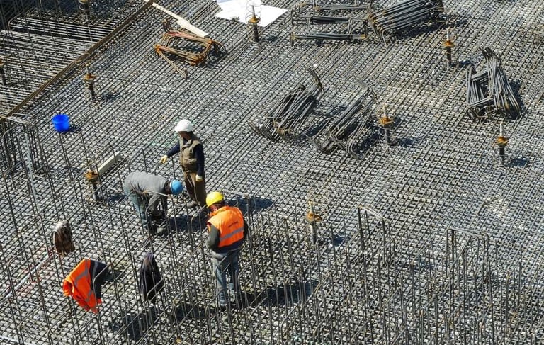 a group of workers working on a construction site