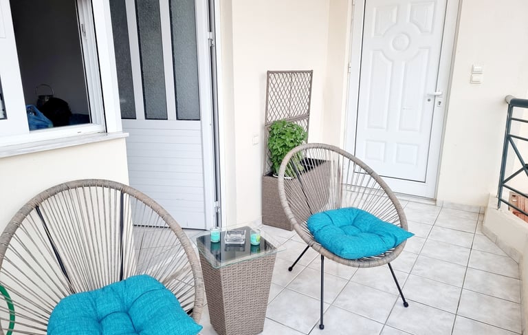 a patio with a chair and a table
