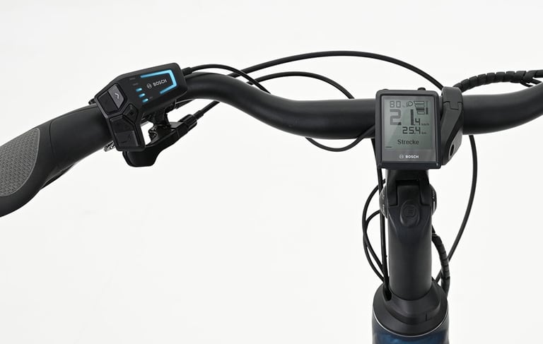 Bosch electric bike handlebar with digital Intuvia display and LED remote control on a white background.