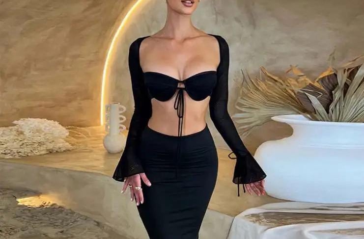 a woman in a black dress with a black dress