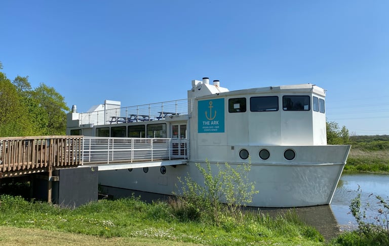The ark northampton, a large white boat on the river nene, on a sunny summer day
