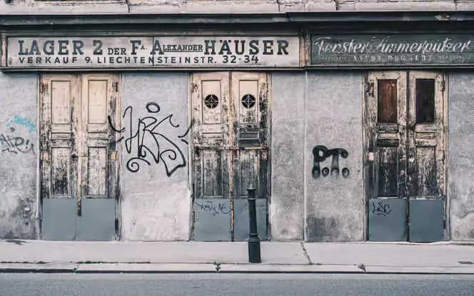 old viennese building facade with vintage signs and graffiti street art