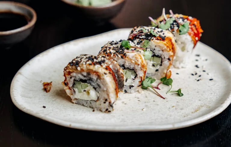 Crispy maki rolls with sesame seeds and microgreens on ceramic plate, Kyoto sushi workshop