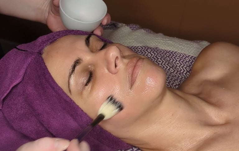 woman getting a mask during a facial treatment