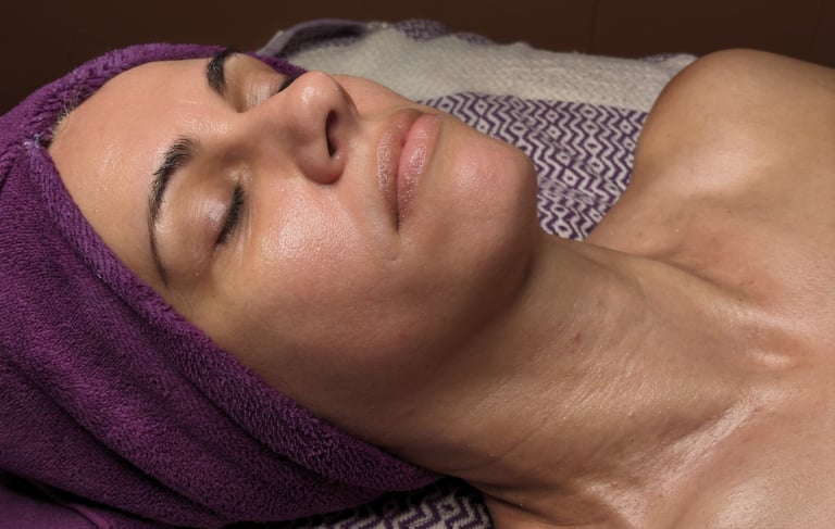 woman getting a facial at a spa