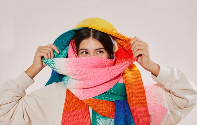 a woman wearing a colorful scarf around her neck