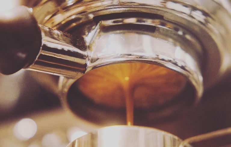 a coffee maker is making a cup of coffee