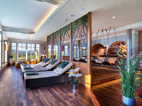 a living room with a couch and a large window