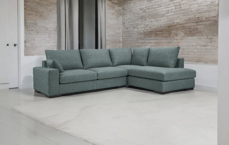 a couch with a large sectional couch in a room