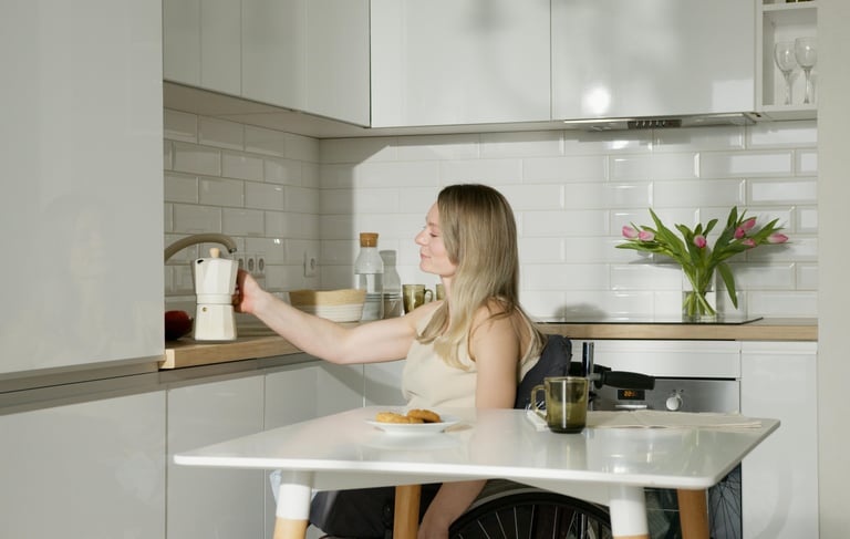 a woman sitting at a table with a bottle of wine