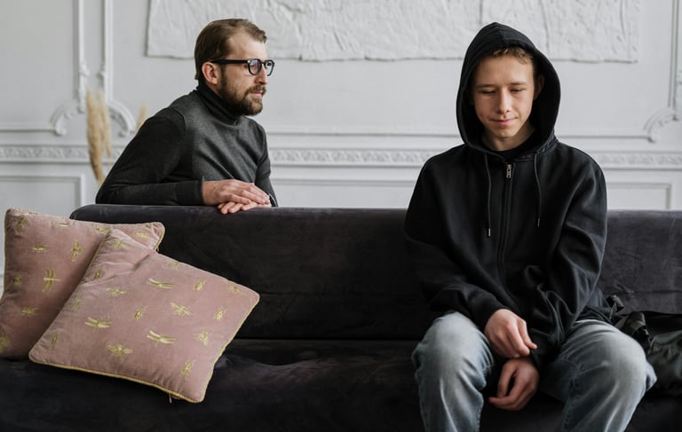a man and woman sitting on a couch