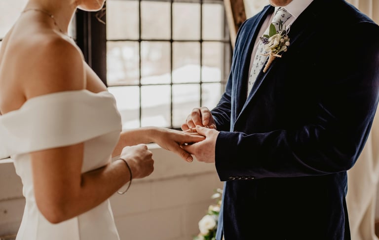 a man and woman getting married in a wedding ceremony